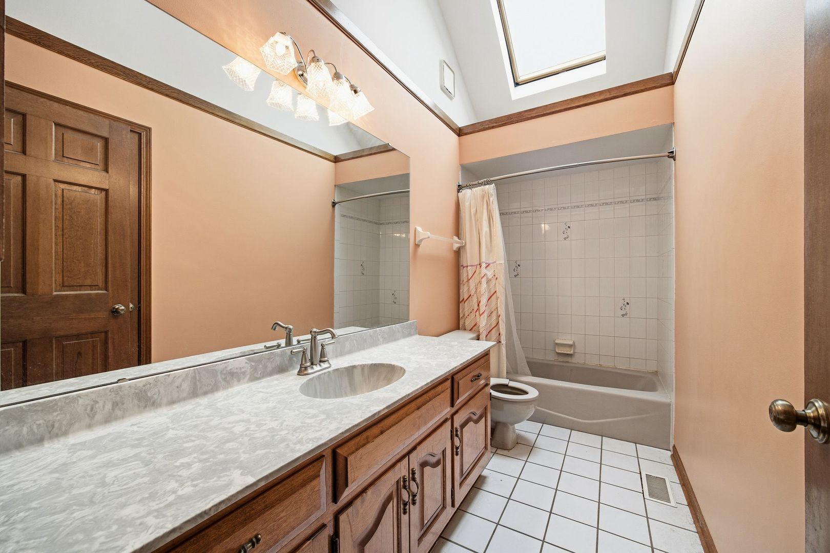 1333 Sable Drive Addison, IL 60101 - Photo 23 of 29 a bathroom with a granite countertop sink a toilet and shower