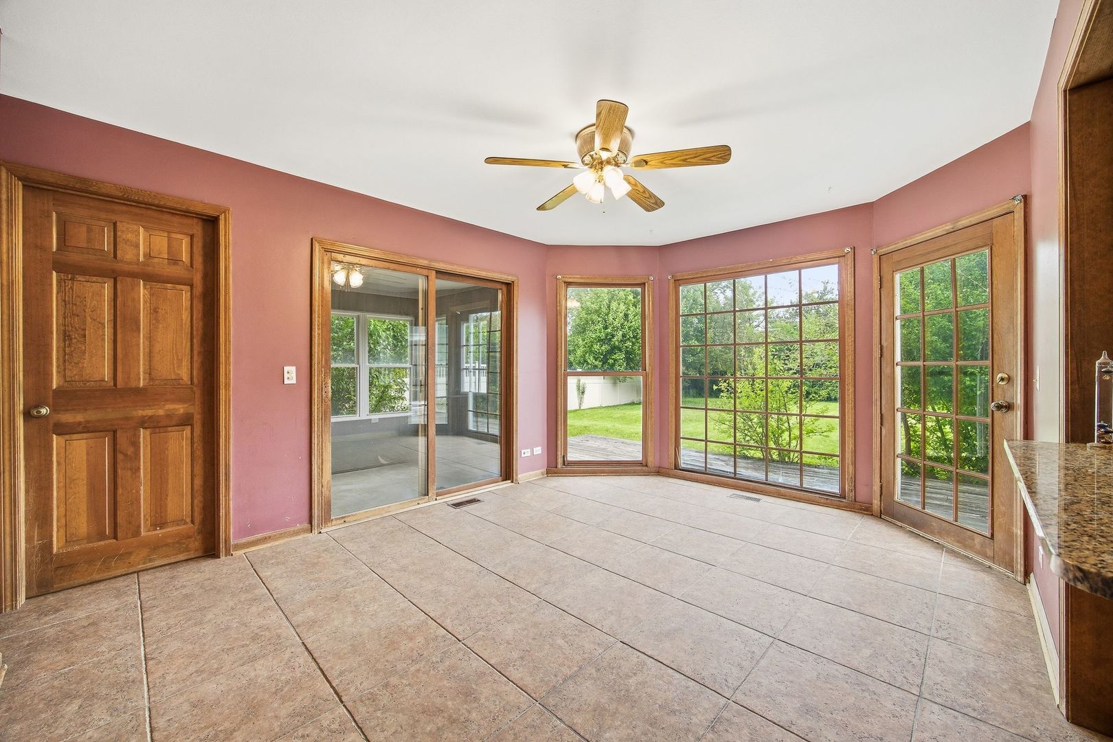 1333 Sable Drive Addison, IL 60101 - Photo 6 of 29 a large bedroom with a large bed and a chandelier fan