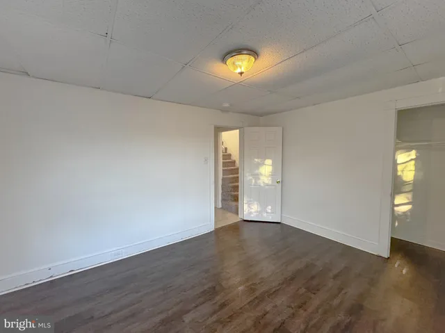 a view of livingroom with window ceiling fan and hardwood floor