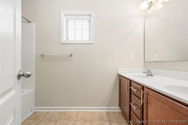 a bathroom with a sink a vanity and a mirror