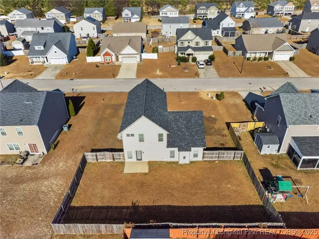 an aerial view of a house with a ocean view