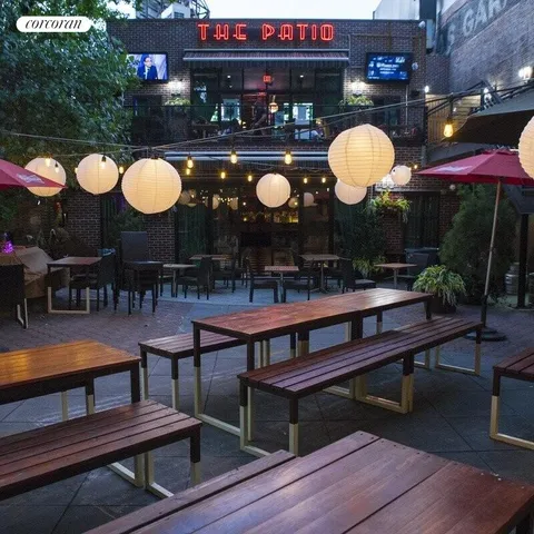 a living room with table and a chairs