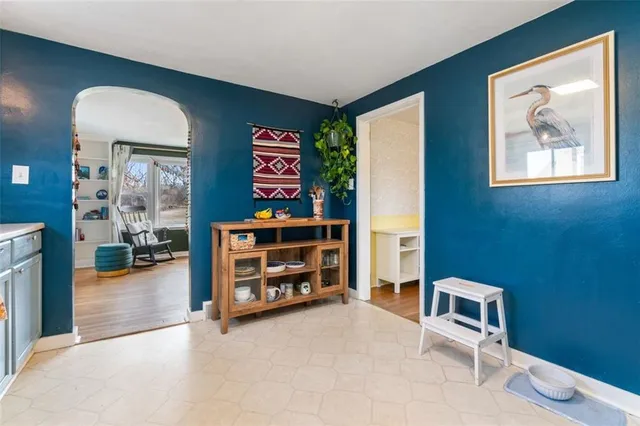 a view of a livingroom with furniture and closet