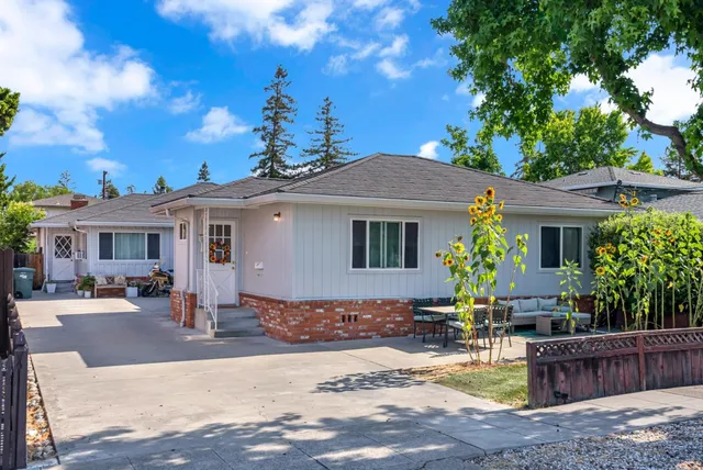a front view of a house with garden