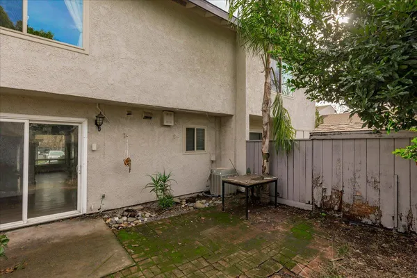 a view of backyard with seating space