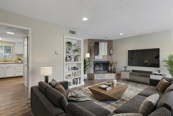 a living room with furniture and a flat screen tv