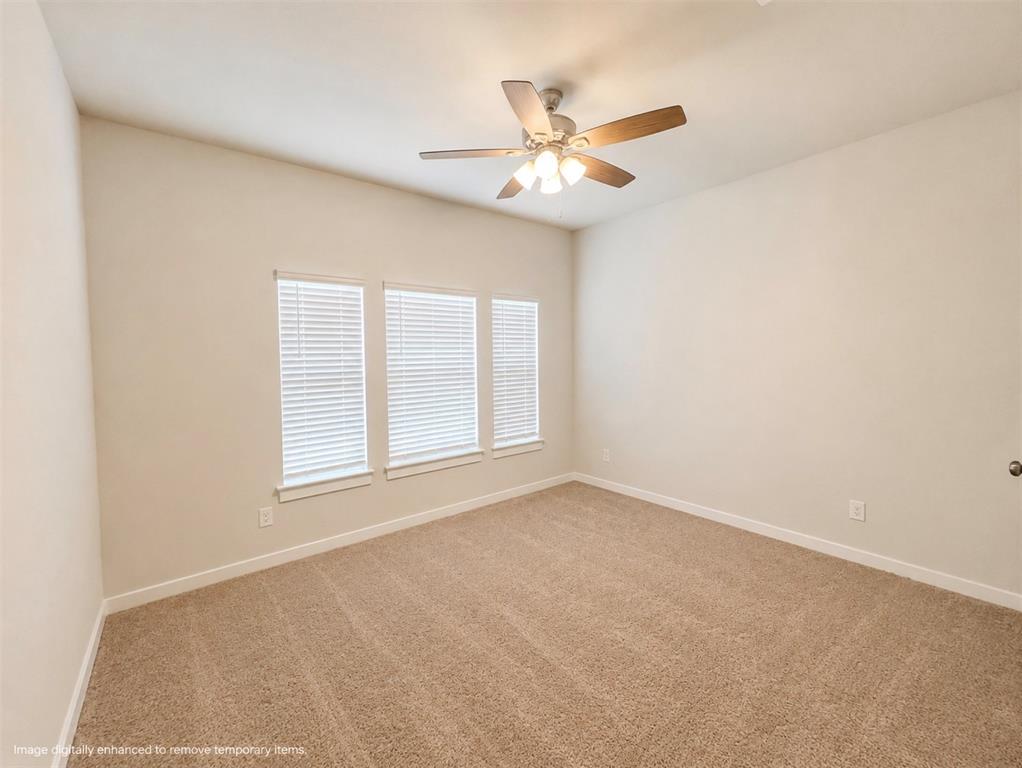 631 Cari Lane Forney, TX 75126 - Photo 8 of 17 Bright and spacious bedroom featuring neutral wall finishes, plush carpeting throughout, recessed lighting, and a ceiling fan with integrated light fixture