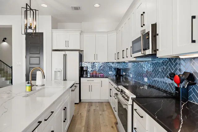 a spacious bedroom with a bed and a window