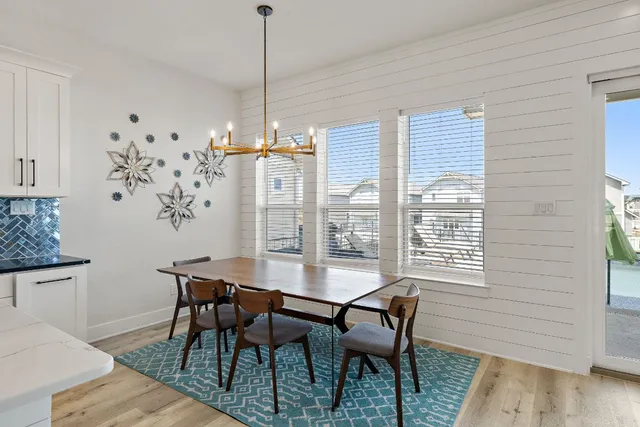 a kitchen with stainless steel appliances granite countertop a stove top oven a refrigerator a sink and dishwasher