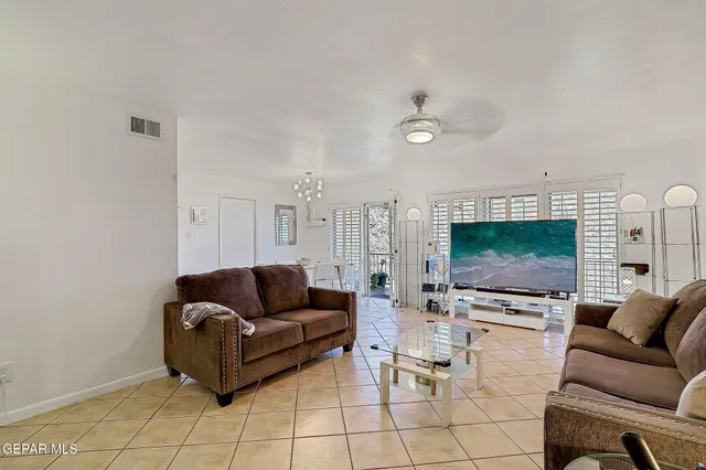 a bathroom with a toilet sink vanity and mirror