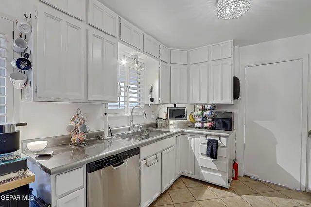 a view of a bedroom with closet and furniture