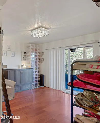 a view of swimming pool with outdoor seating and plants