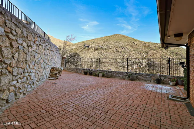 a view of a pathway both side of house