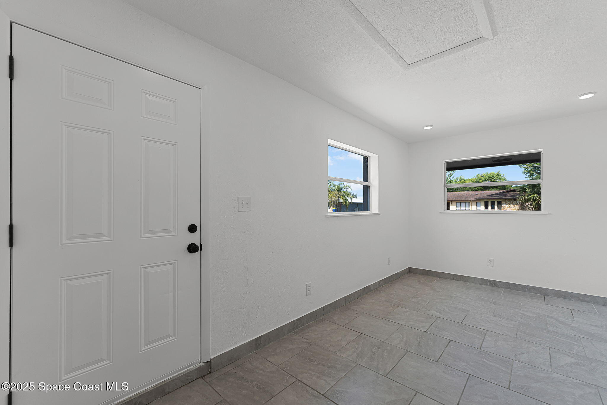 2412 Yule Tree Drive Edgewater, FL 32141 - Photo 16 of 35 a view of an empty room with a window