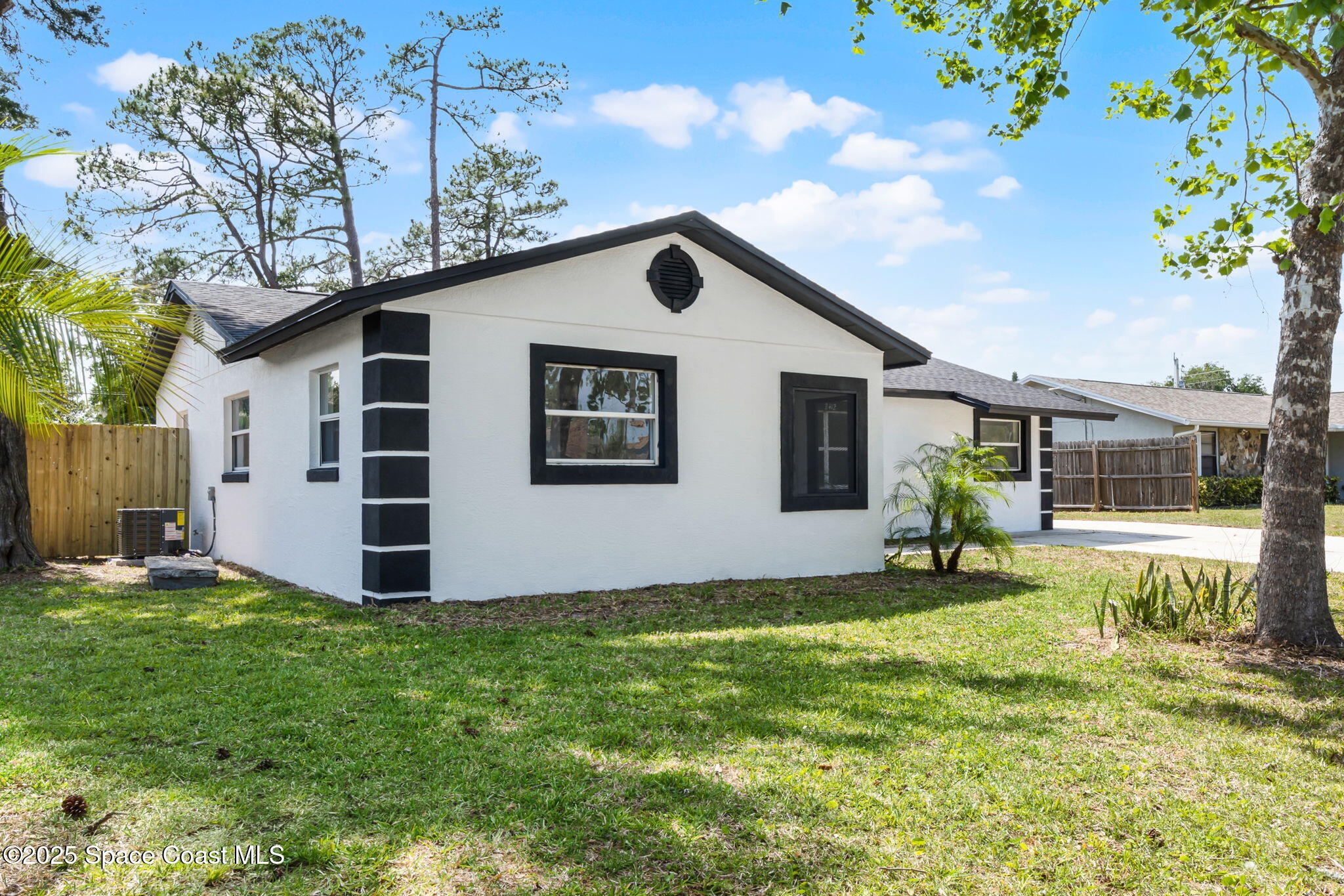 2412 Yule Tree Drive Edgewater, FL 32141 - Photo 2 of 35 a house view with a garden space