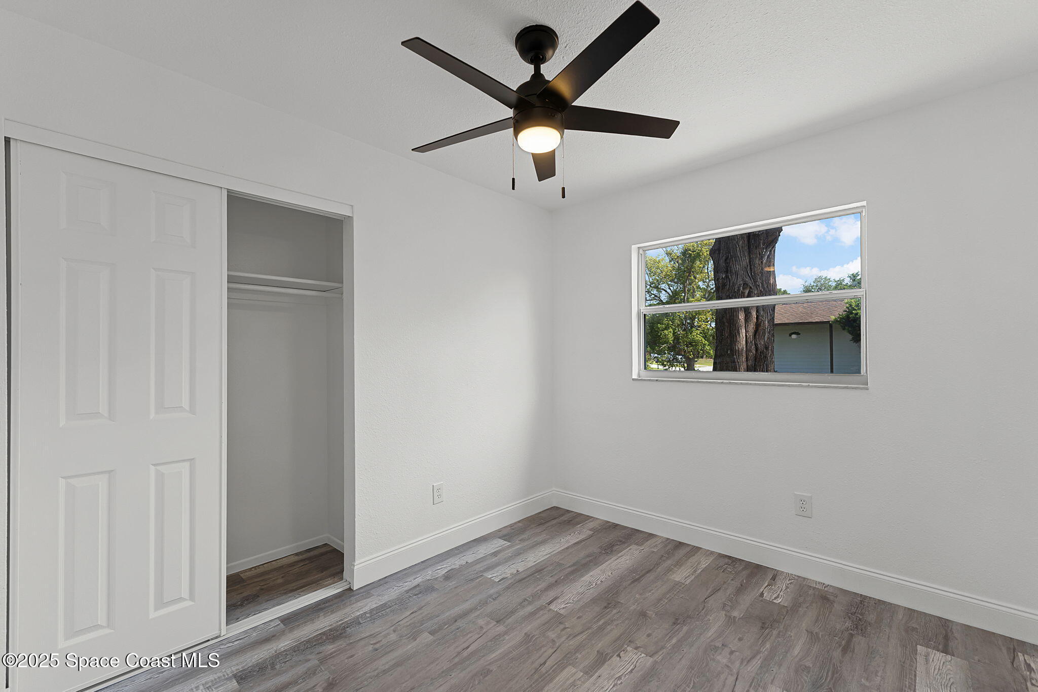 2412 Yule Tree Drive Edgewater, FL 32141 - Photo 22 of 35 wooden floor in an empty room