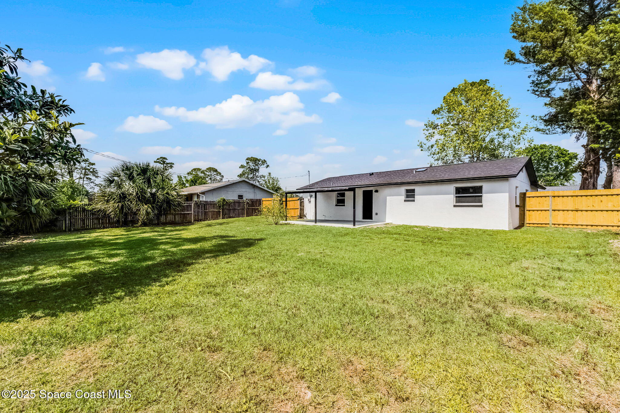 2412 Yule Tree Drive Edgewater, FL 32141 - Photo 26 of 35 a front view of house with yard and green space