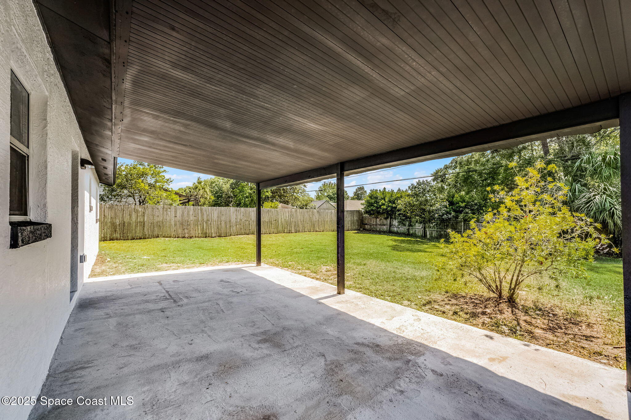 2412 Yule Tree Drive Edgewater, FL 32141 - Photo 27 of 35 a view of an empty room with yard and balcony