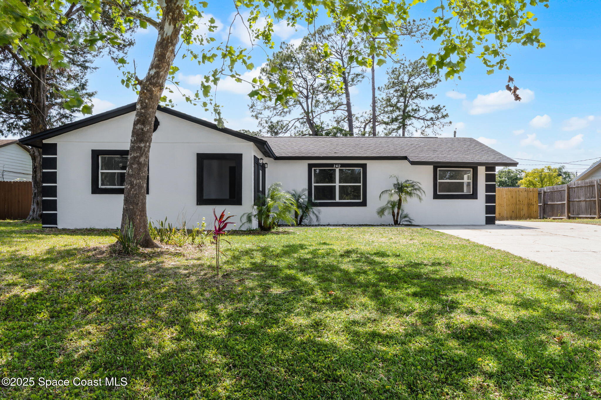 2412 Yule Tree Drive Edgewater, FL 32141 - Photo 3 of 35 a front view of house with yard and trees