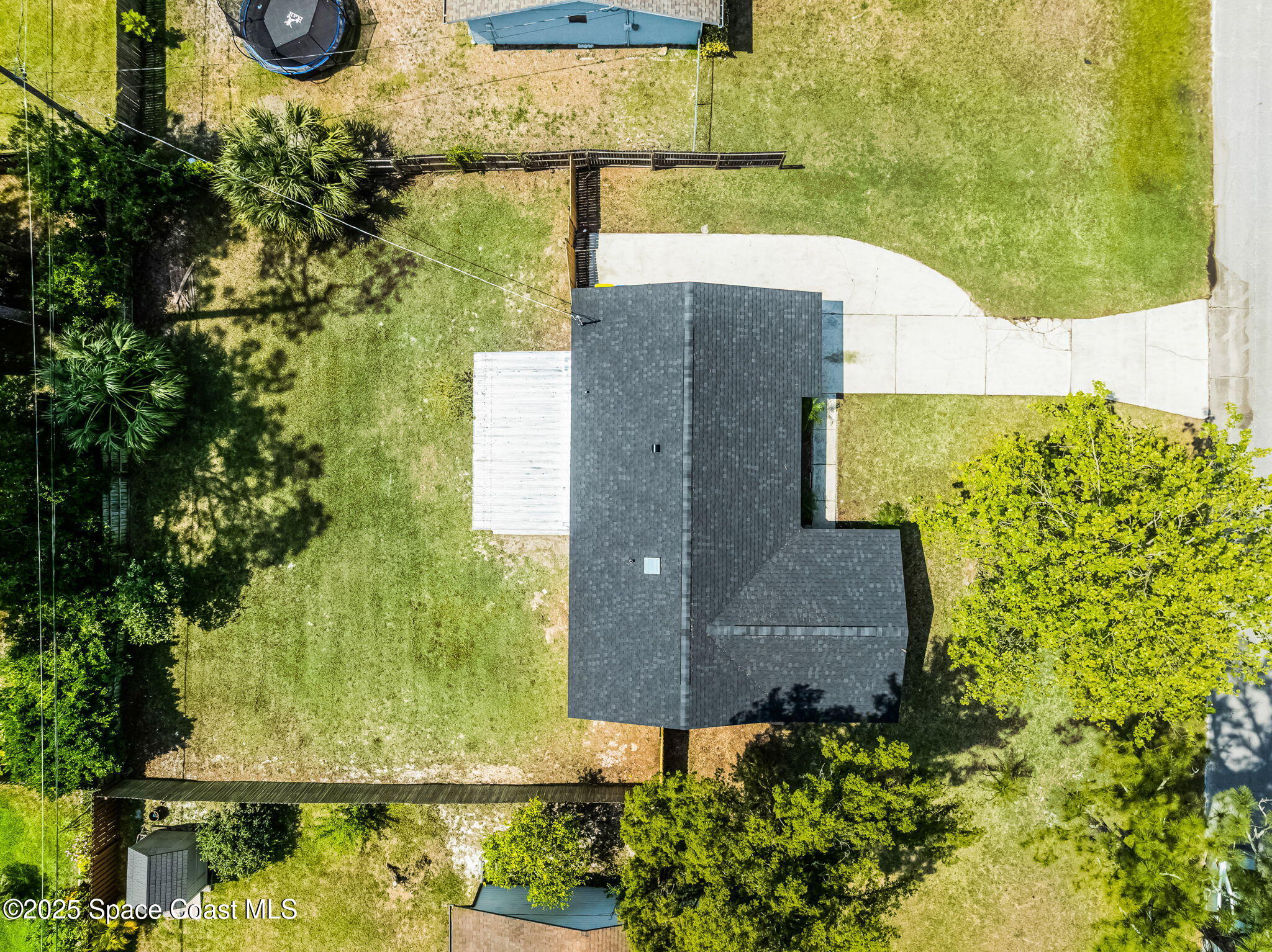 2412 Yule Tree Drive Edgewater, FL 32141 - Photo 31 of 35 an aerial view of a house with a yard