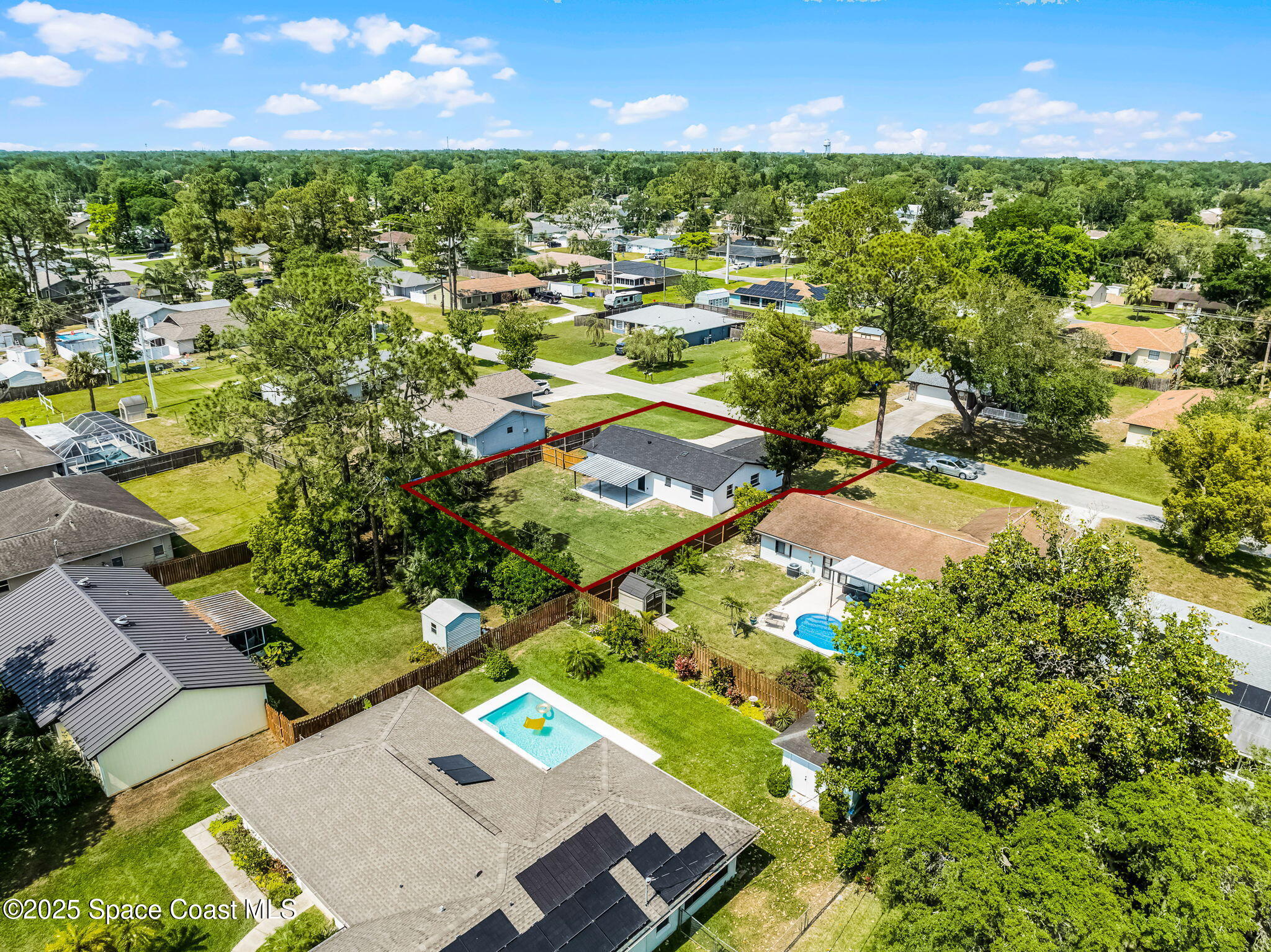 2412 Yule Tree Drive Edgewater, FL 32141 - Photo 33 of 35 an aerial view of residential houses with outdoor space and trees