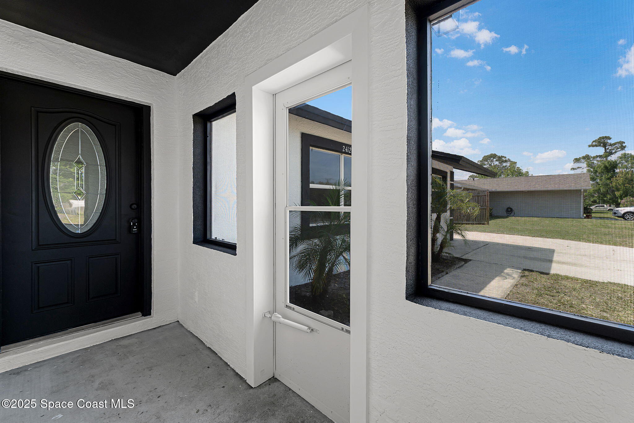 2412 Yule Tree Drive Edgewater, FL 32141 - Photo 5 of 35 a view of a door and a window of the house