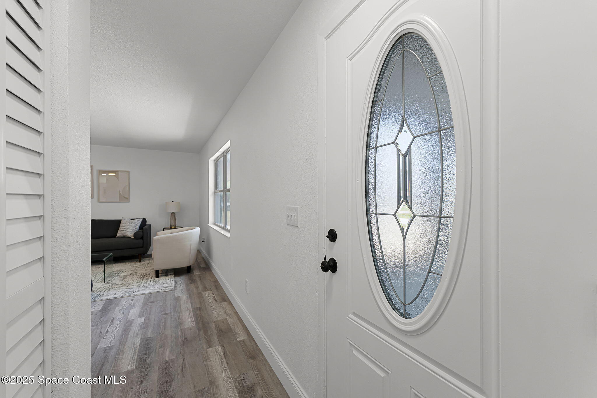2412 Yule Tree Drive Edgewater, FL 32141 - Photo 6 of 35 a view of a livingroom with furniture and wooden floor