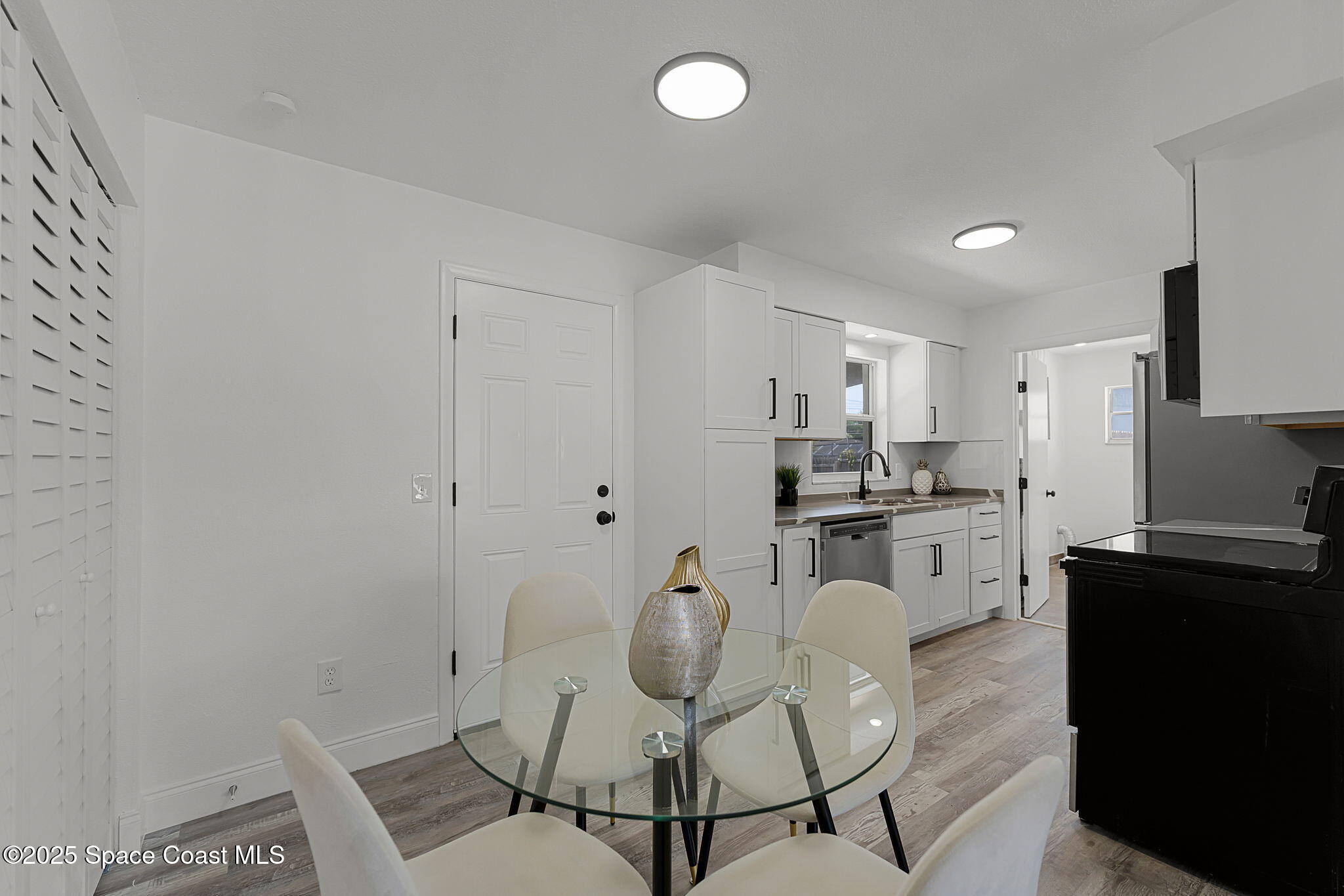 2412 Yule Tree Drive Edgewater, FL 32141 - Photo 10 of 35 a kitchen with granite countertop cabinets and chairs