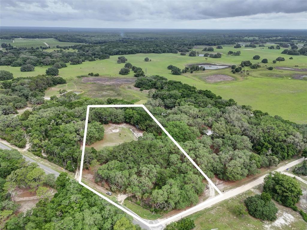 156 Kingfish Road Pomona Park, FL 32181 - Photo 2 of 55 a view of a field with an ocean