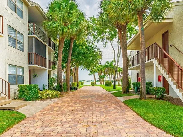 a view of a building with a yard