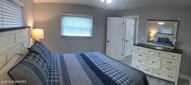 a bedroom with a bed and a dresser