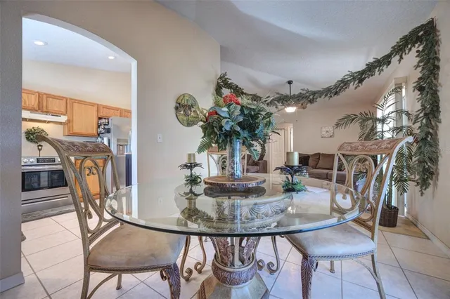 a view of a dining room with furniture and a chandelier