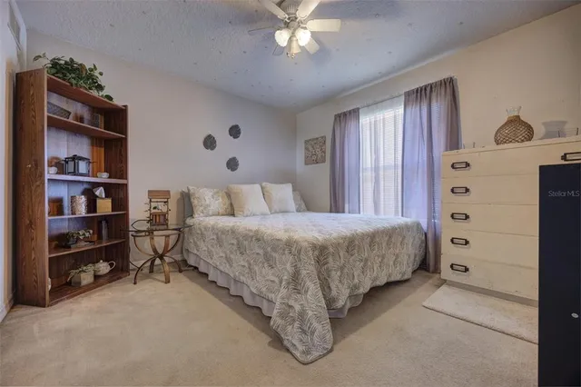 a bedroom with a bed and a cabinets