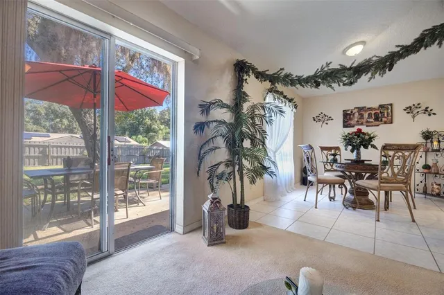 a view of a livingroom with furniture and a potted plant