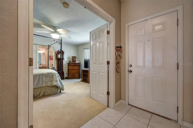 a view of a livingroom with furniture and a bathroom