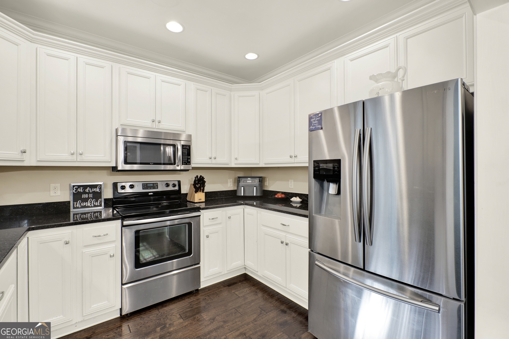 359 LaFayette Road Rocky Face, GA 30740 - Photo 34 of 54 a kitchen with white cabinets and stainless steel appliances