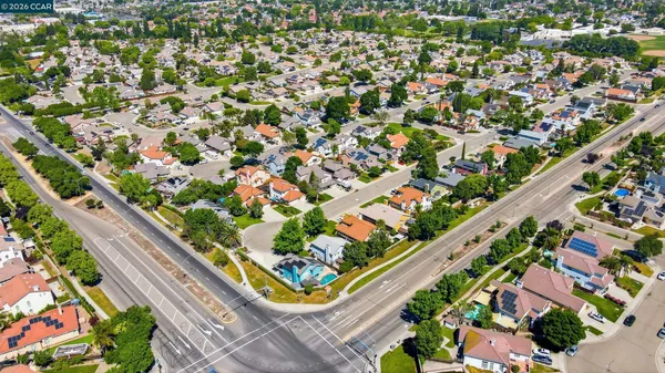 an aerial view of residential houses with outdoor space