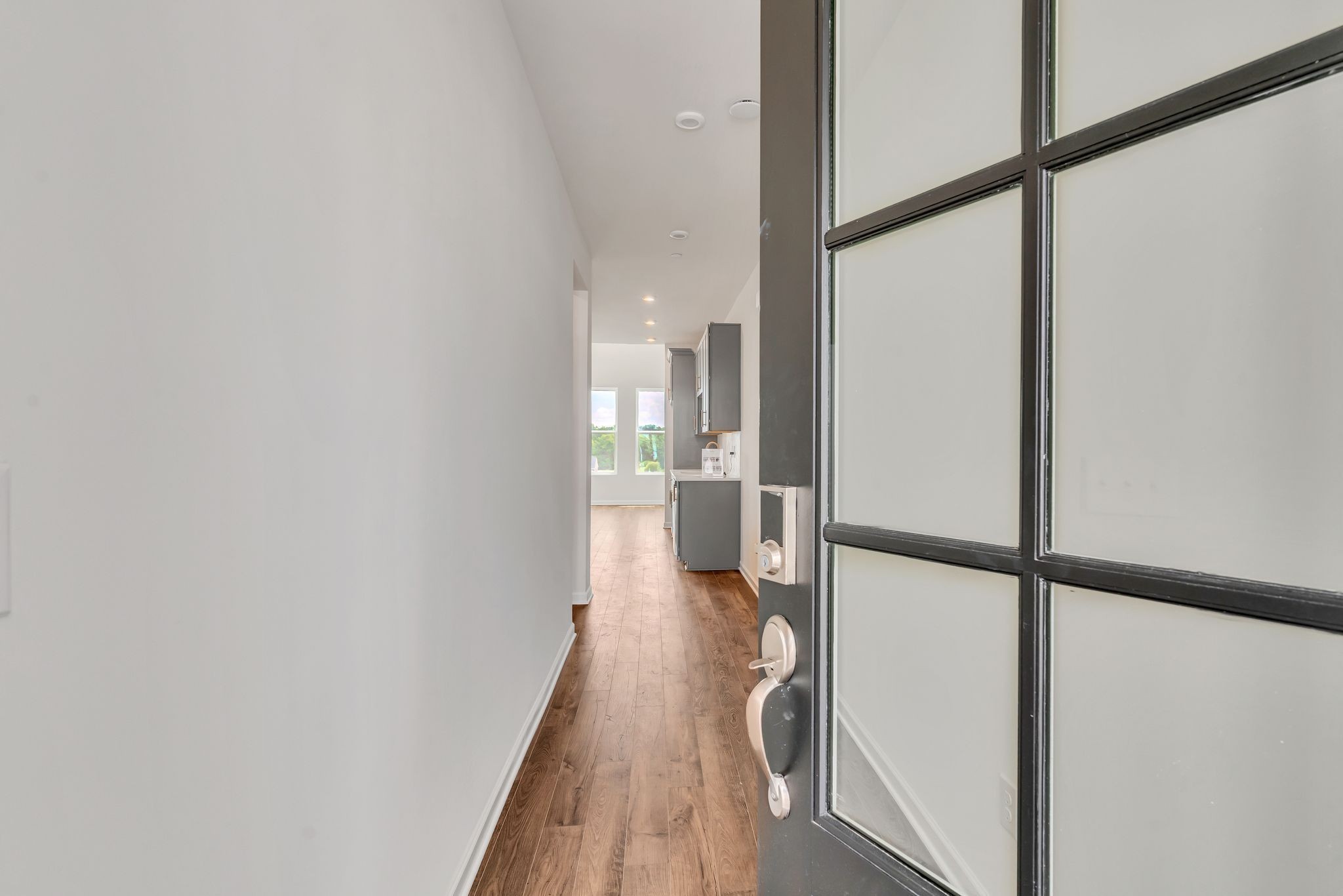 621 Club View Way Mount Juliet, TN 37122 - Photo 4 of 36 a view of a hallway with wooden floor and staircase