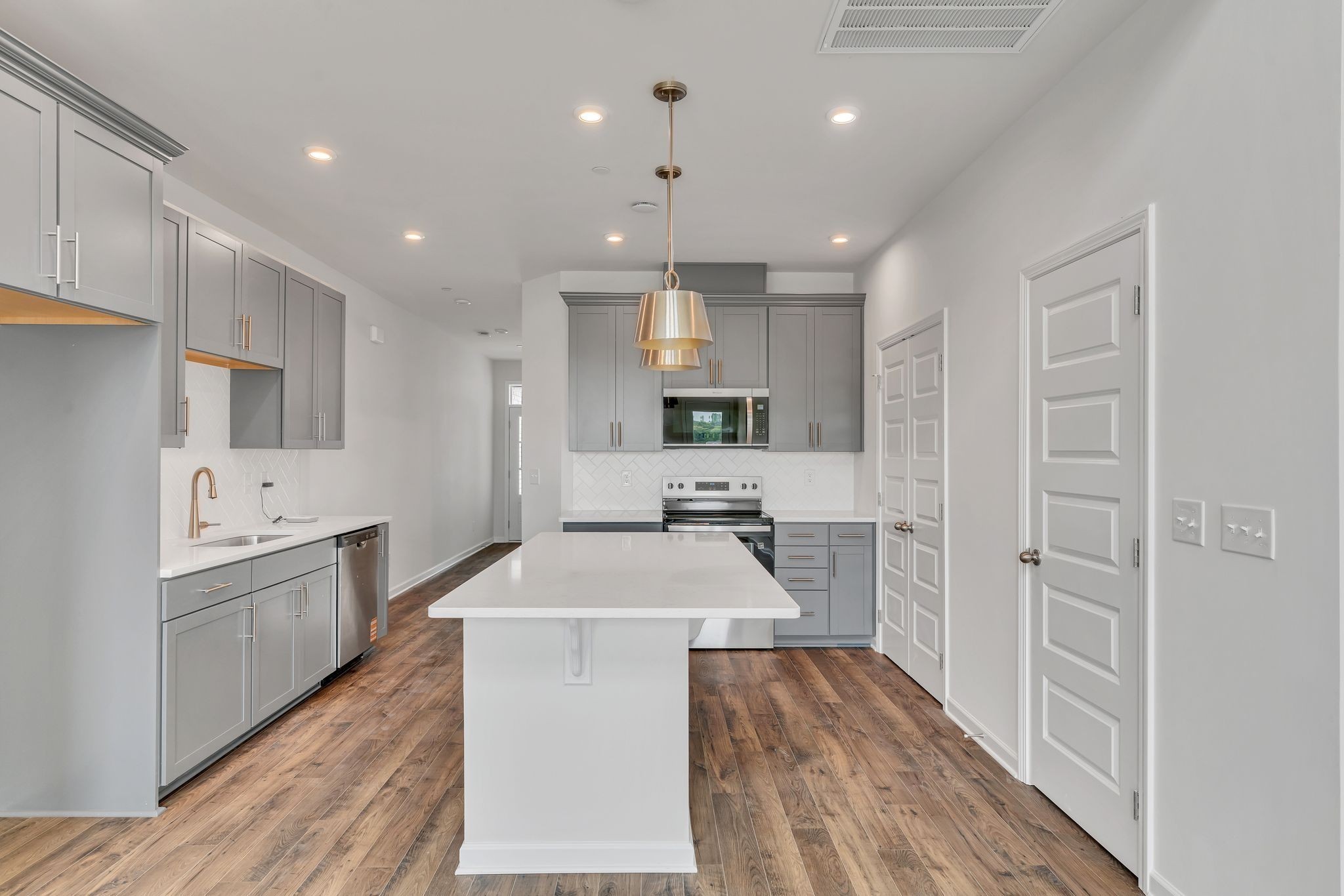 621 Club View Way Mount Juliet, TN 37122 - Photo 8 of 36 a large kitchen with stainless steel appliances kitchen island granite countertop a sink and cabinets