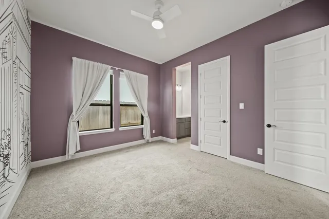 an empty room with windows and closet