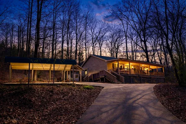 a front view of house with yard and trees