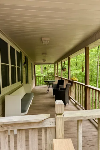 a view of a patio with a table chairs and a potted plant