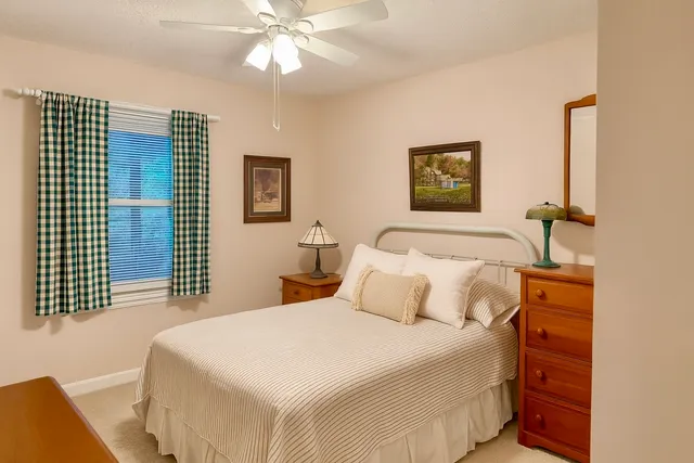 a view of a bathroom with a tub and shower