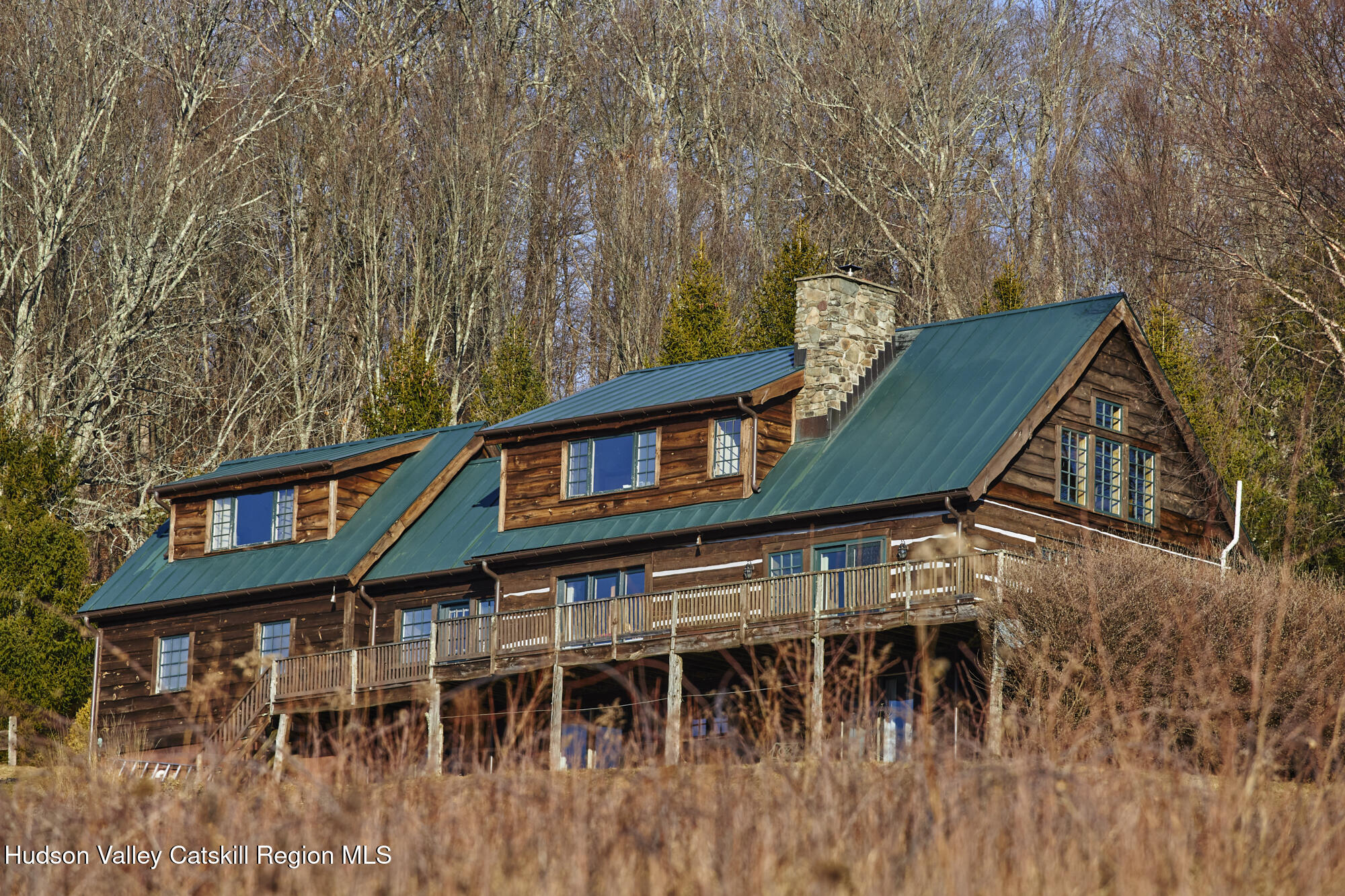 87 Kaye Road Millerton, NY 12546 - Photo 37 of 46 a front view of a house with a yard and balcony