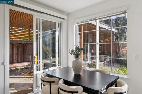 a kitchen with a refrigerator and a stove top oven