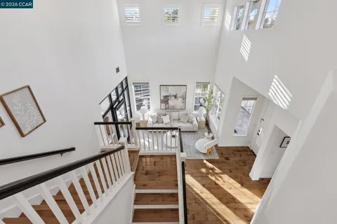 a bedroom with a bed and a potted plant