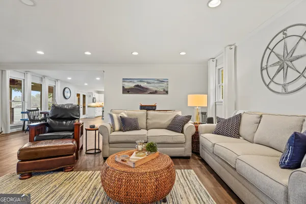 a living room with furniture a rug and a couch
