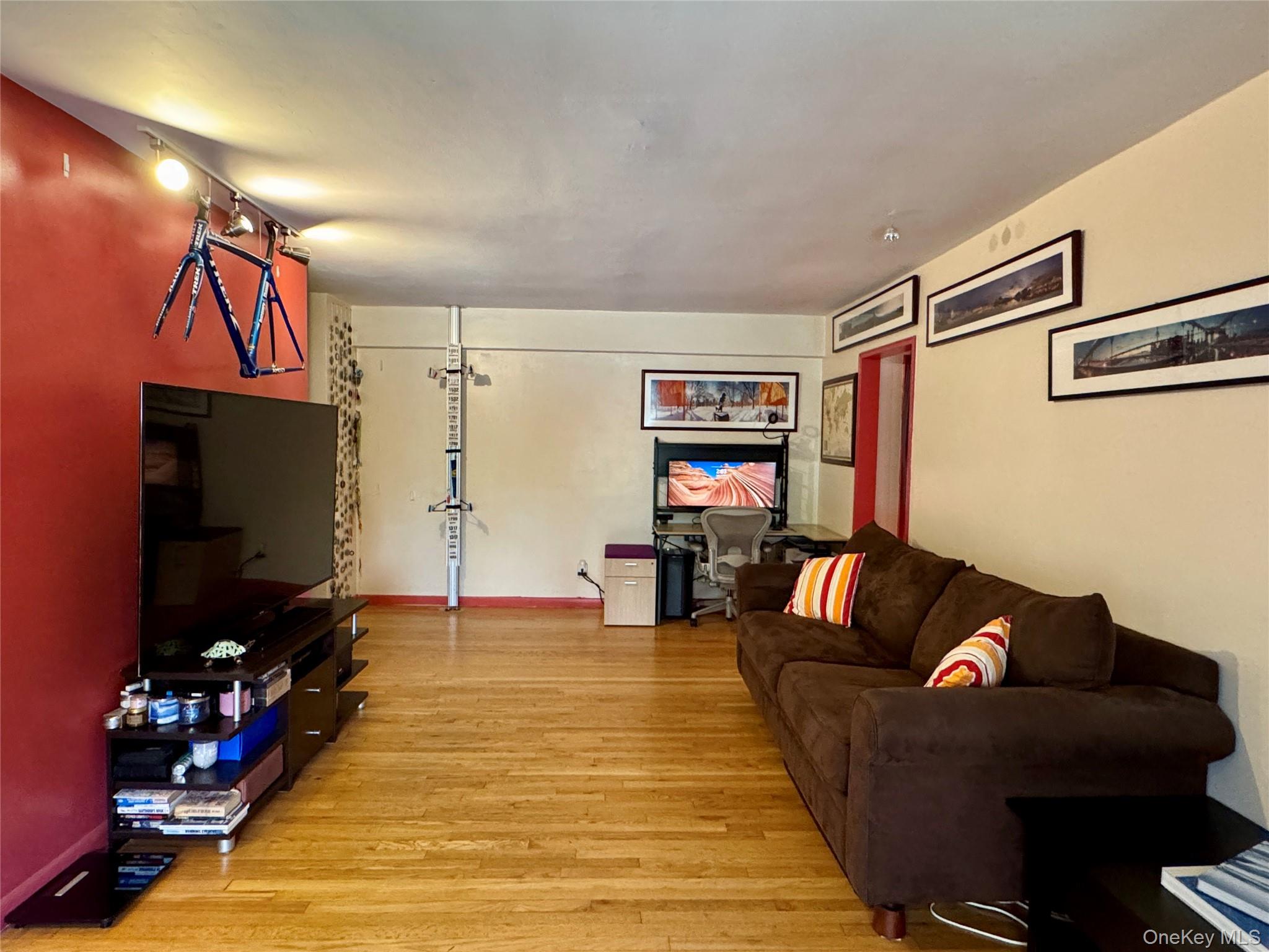 a living room with furniture and a flat screen tv