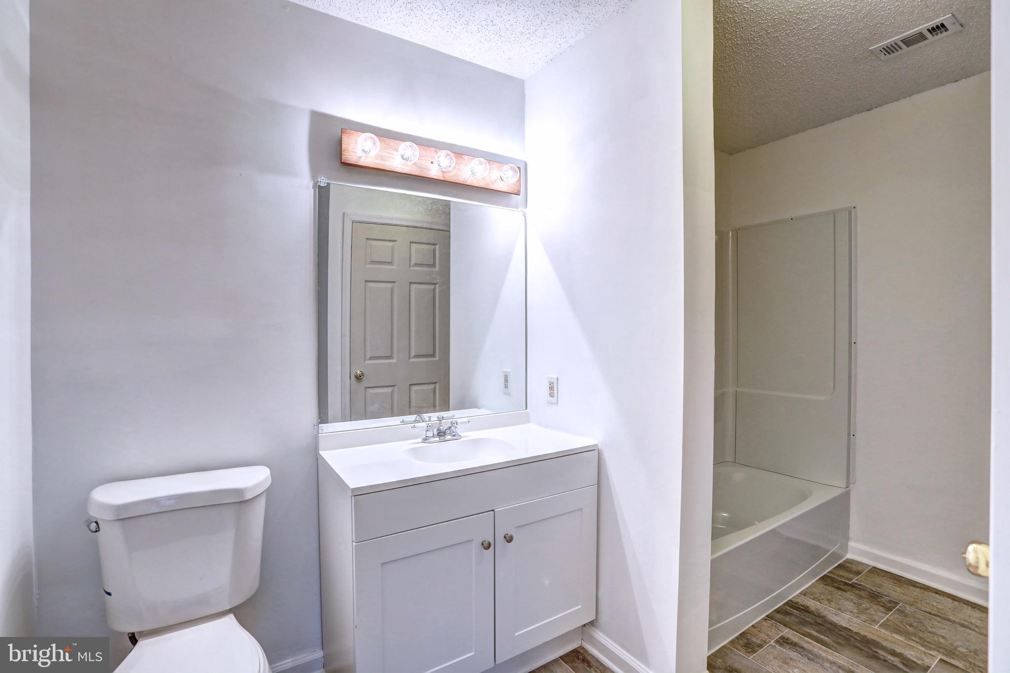 20957 Timber Ridge Terrace, Unit 104 Ashburn, VA 20147 - Photo 14 of 21 All new Bathroom