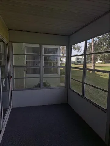 a view of empty room with windows